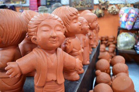 Girl clay sculpture watches