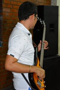 Male musician playing the guitar photo