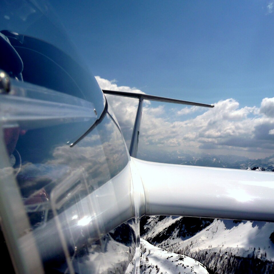 Above the clouds wing mountains photo