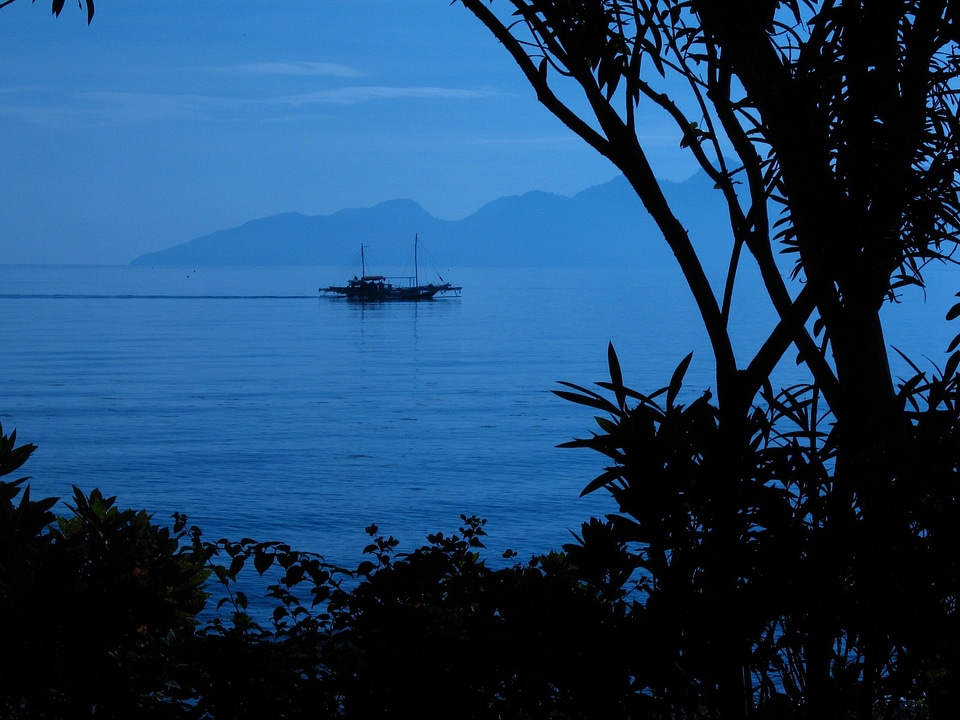 Silhouette water mountains