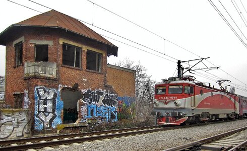 Train locomotive brick wall photo