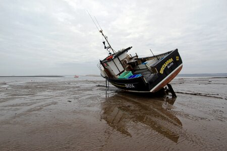 Sea shore fishing boat photo