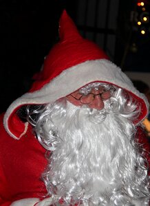 Christmas santa claus beard santa claus in red coat photo