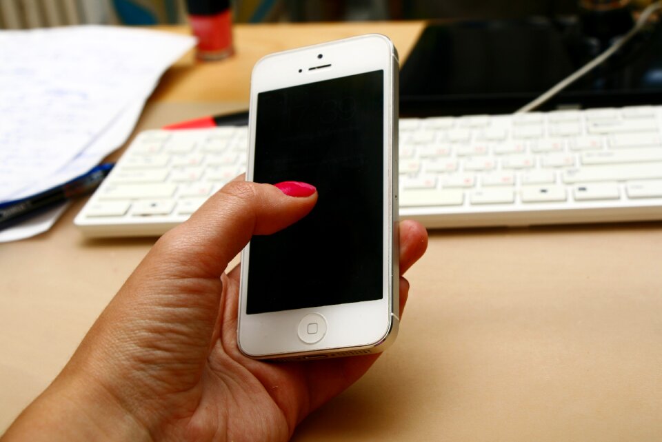Hand with telephone phone at work