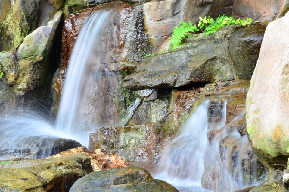 Waterfall rocks trail of water