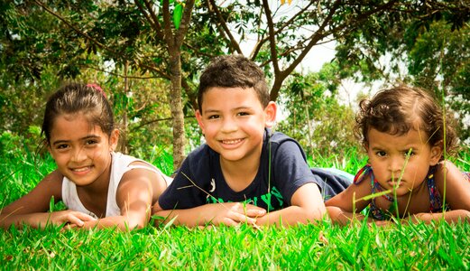 Park children lying in the grass