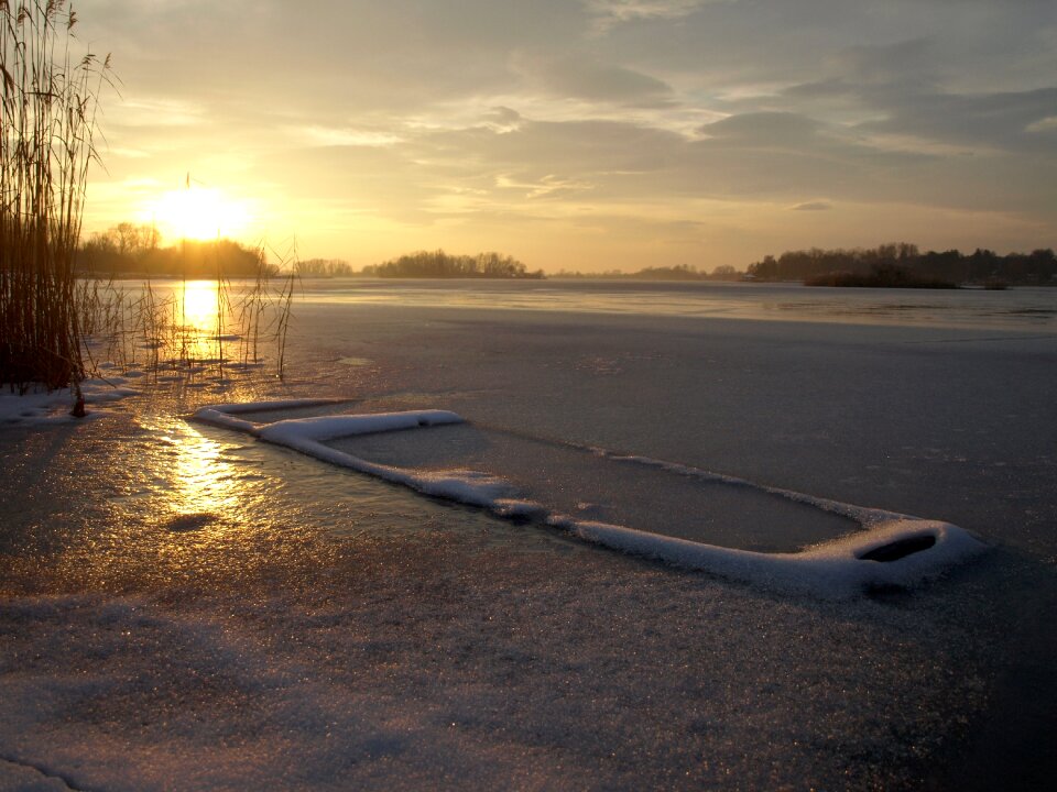 Winter frozen rowboat