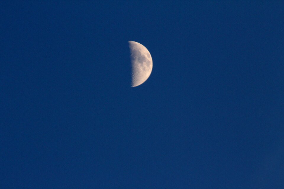 Half moon dark sky blue