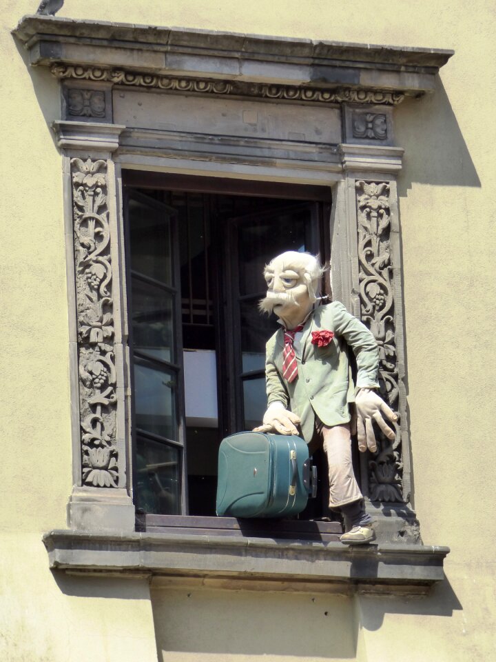 Figure suitcase escape building