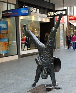 Human handstand bronze sculpture photo