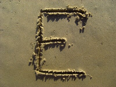 Beach alphabet brown letter