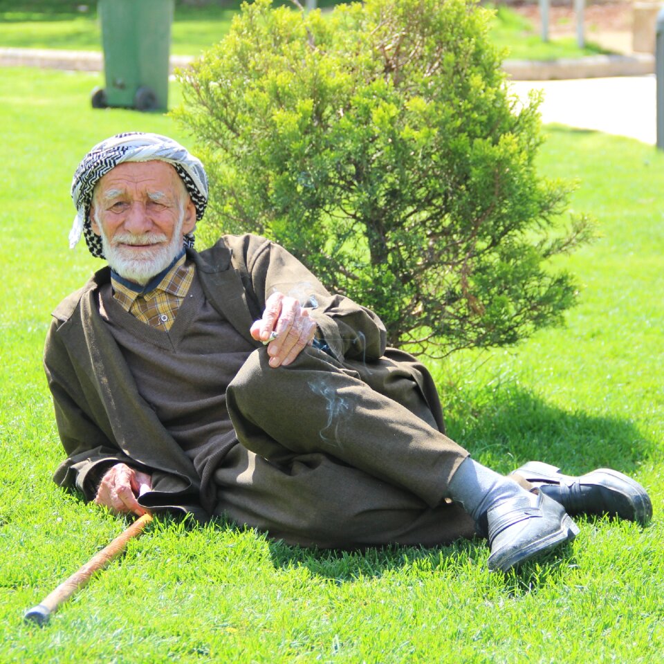 Old muslim smoking