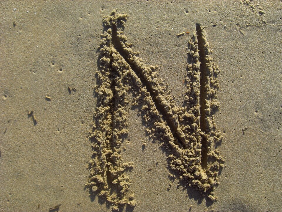 Beach alphabet brown letter
