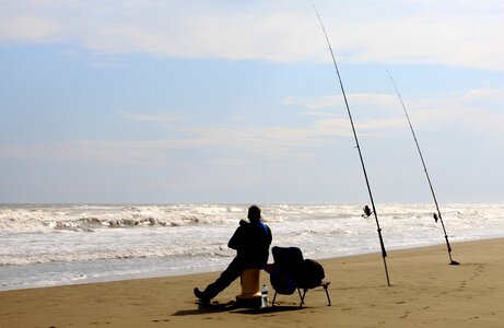 Fisherman fishing rods contemplation