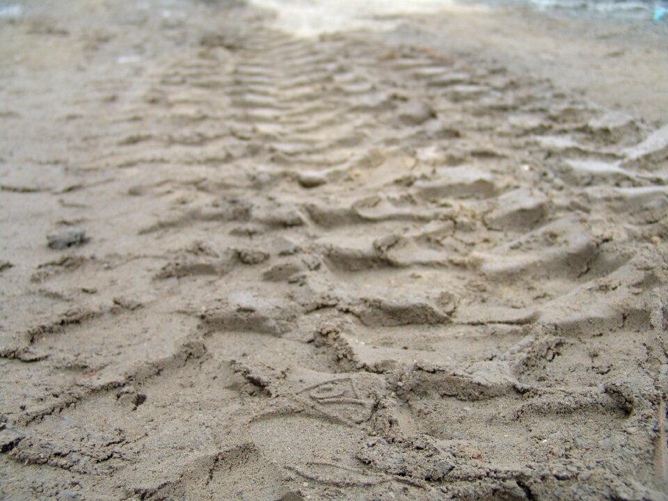 Tire tracks sand site