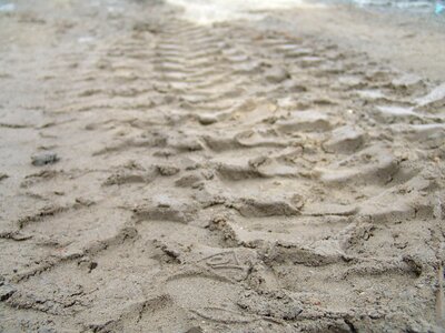 Tire tracks sand site