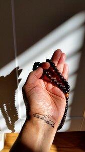 Hand beads meditation photo