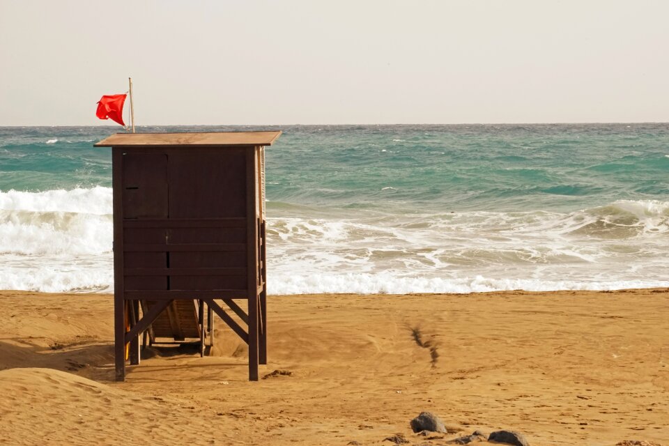 Red flag beach sea