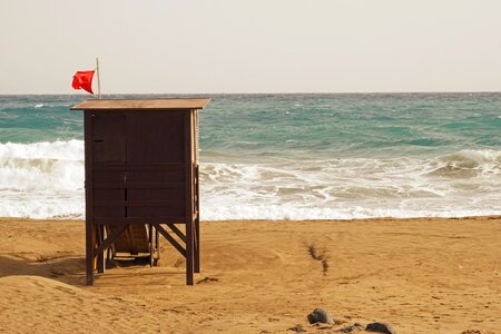 Red flag beach sea photo