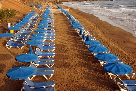 Parasols blue sand beach
