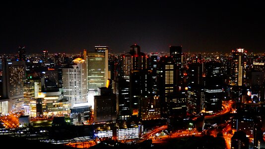 Sky building the night view of osaka building photo