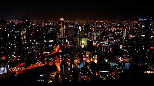 Sky building the night view of osaka building photo