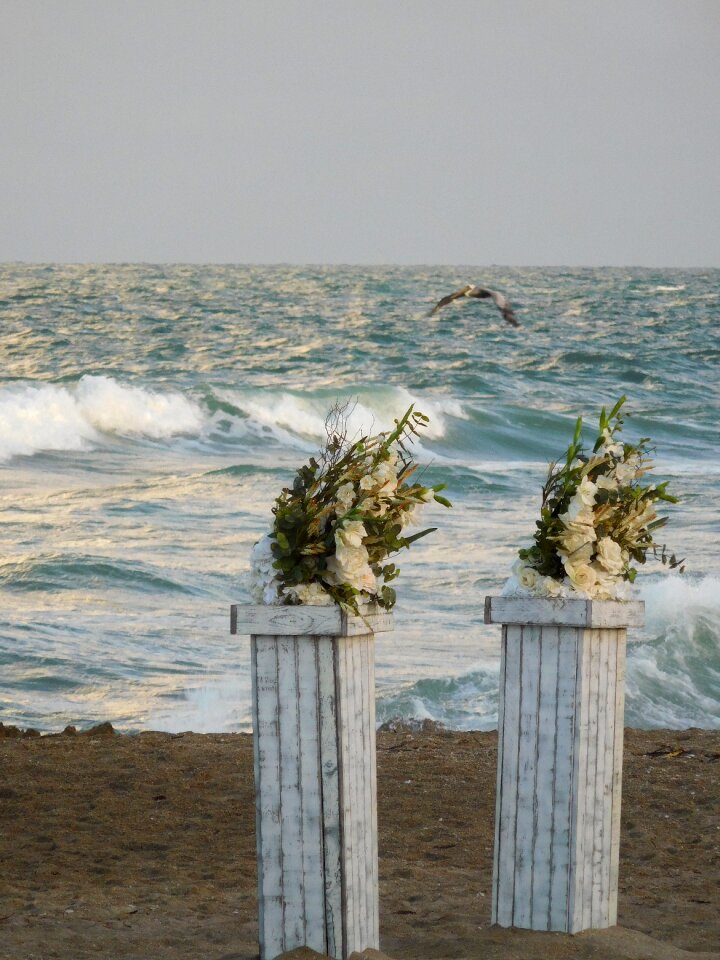 Wedding flowers on a beach shore gray wedding