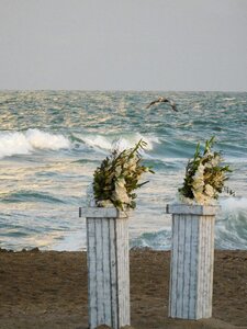 Wedding flowers on a beach shore gray wedding