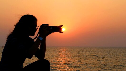 Photographer capturing sun