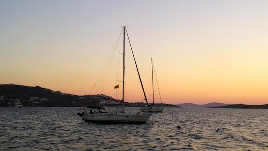 Boat sea setting sun photo