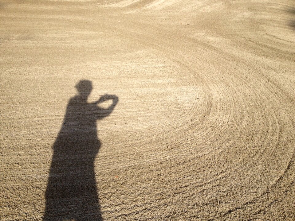 Spirals woman shadow in sand