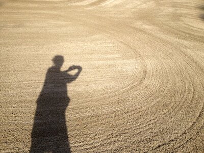Spirals woman shadow in sand
