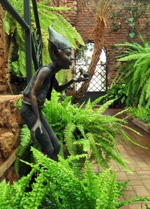 Fantasy statue green house photo