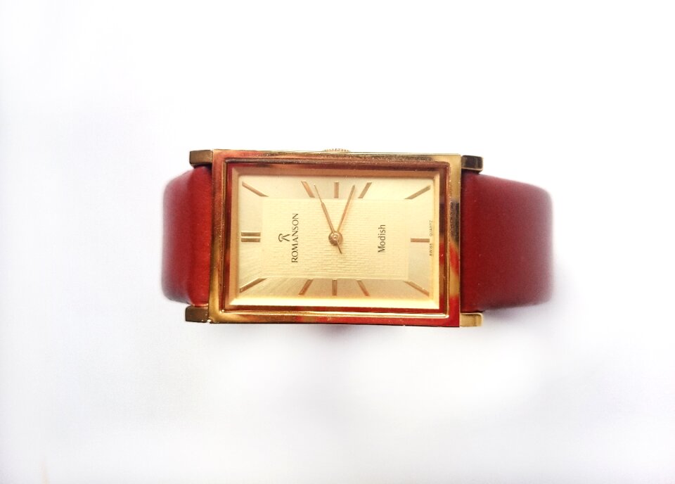 Strap gold dial white background