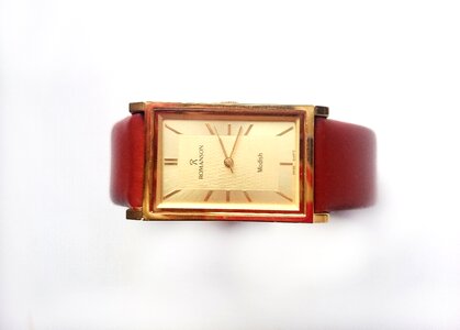 Strap gold dial white background