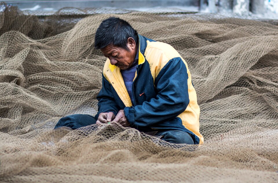 Street photography fishing nets handiwork