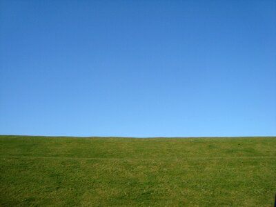 Blue sky green grass landscape