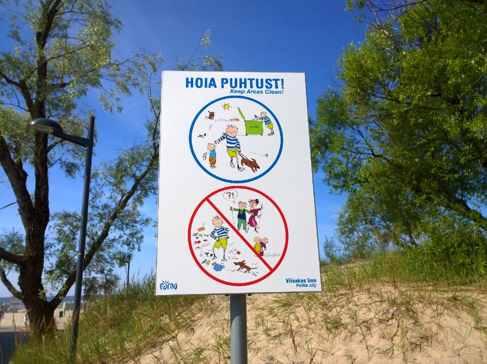 Beach sign sun