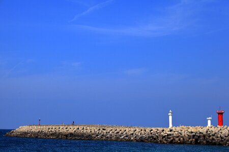 Lighthouse breakwater jeju island photo