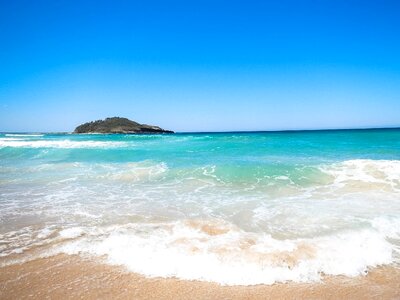 Island blue sky waves