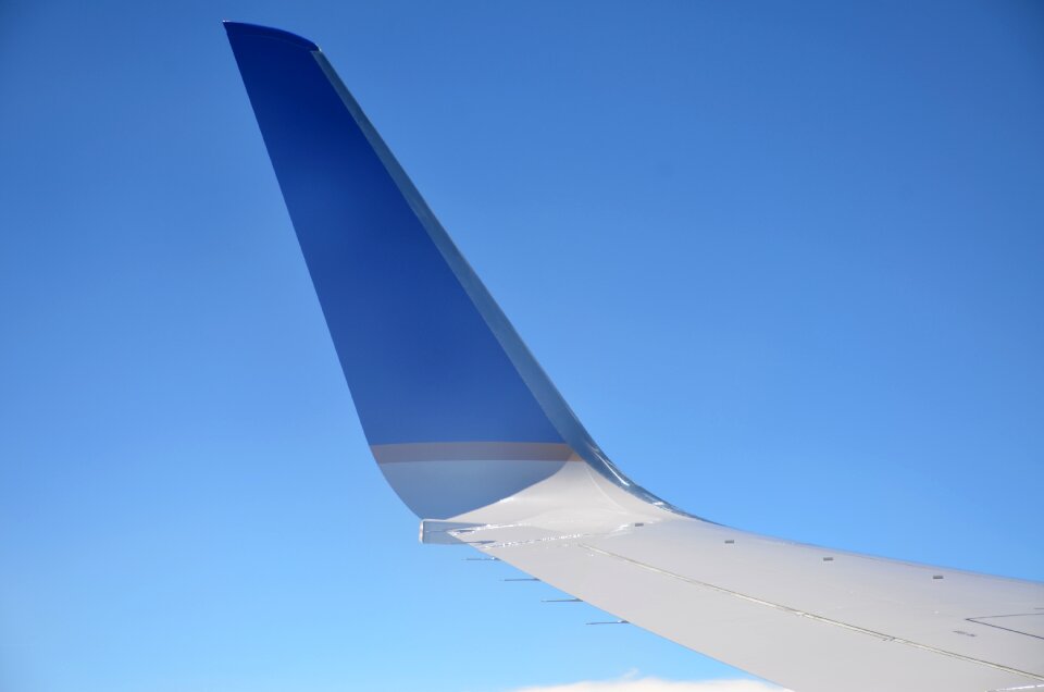 Airplane blue clouds