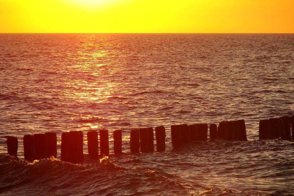 Wood water red sky photo