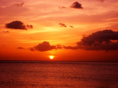 Clouds sun sunset on the sea photo