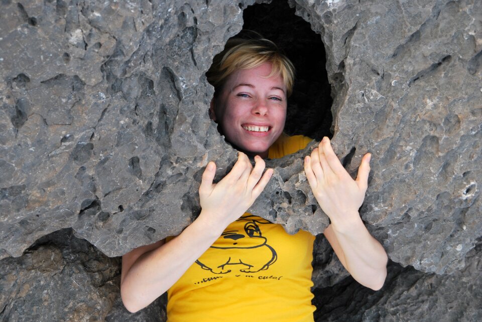 Stone falling smiling woman