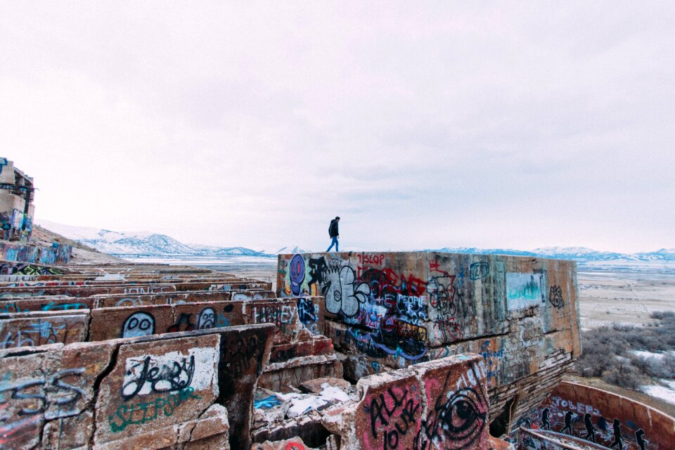Graffiti walls mountains man walking