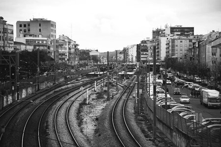 Train line buildings black and white photo
