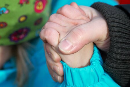 Hands hold tight finger photo