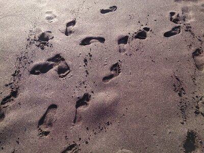 Footprints beach sand photo
