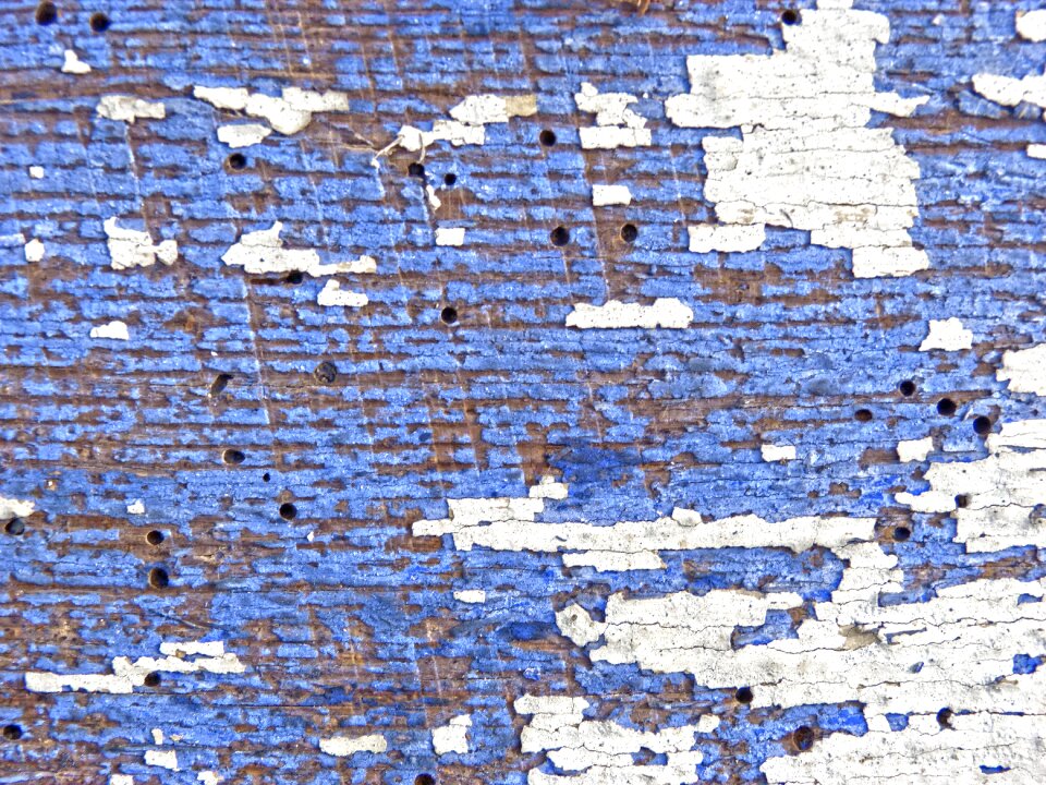 Woodworm peeling paint background