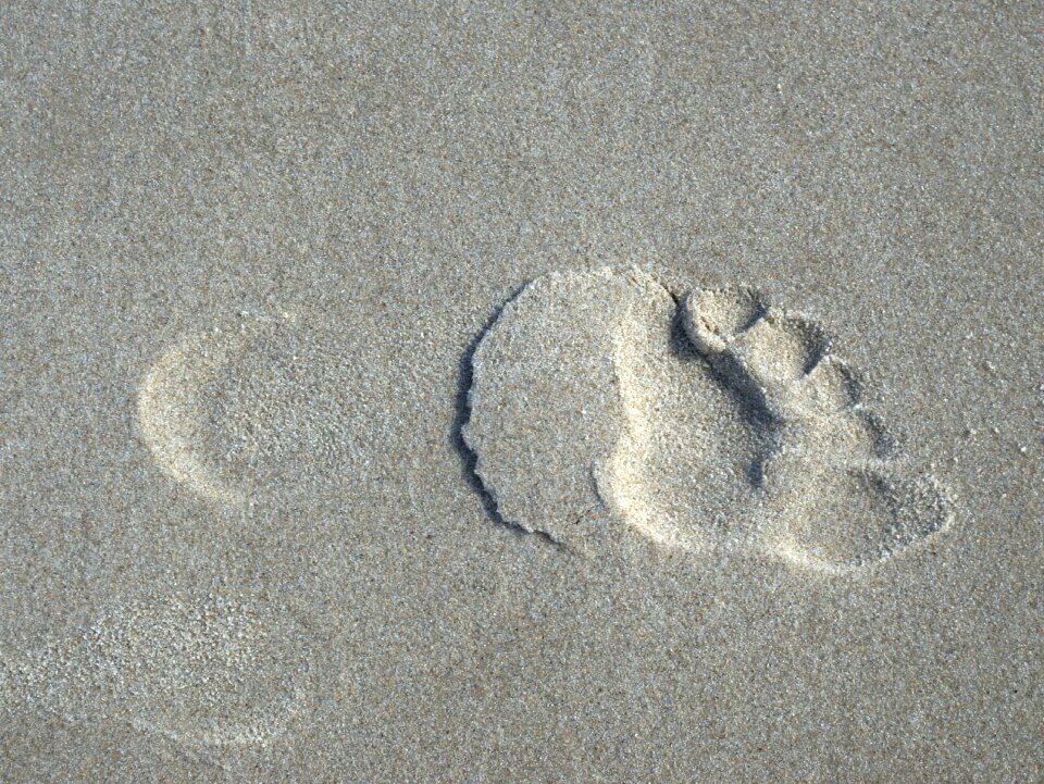 Footprints traces tracks in the sand